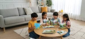 Child reading Biplob adventure books with puzzles colouring books board games and DIY kits nearby